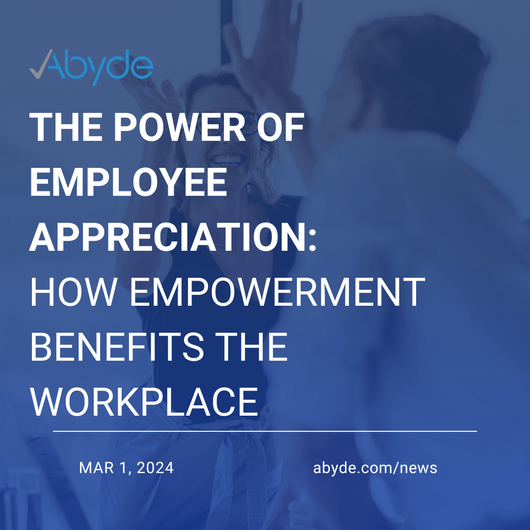 Picture that says, The Power of Employee appreciation, how empowerment benefits the workplace. Faded behind the text has a smiling woman high-fiving a male coworker.